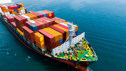 Aerial side view of cargo ship carrying container and running for export  goods  from  cargo yard...