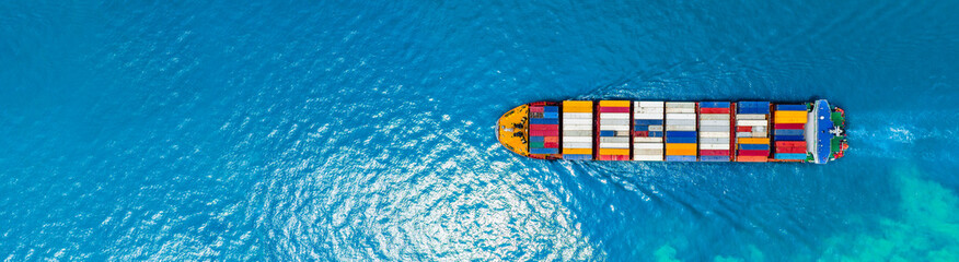 Aerial top view of cargo ship carrying container and running for export  goods  from  cargo yard...