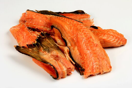 Hot smoked salmon, trout bones on white background