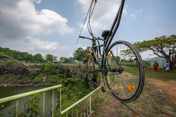 Fototapeta na wymiar Adventure rope Cycling in Hill view park