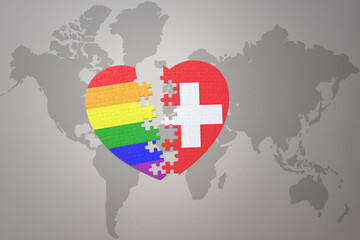 puzzle heart with the rainbow gay flag and switzerland on a world map background. Concept.