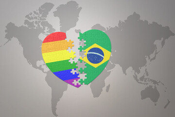 puzzle heart with the rainbow gay flag and brazil on a world map background. Concept.