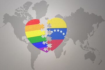 puzzle heart with the rainbow gay flag and venezuela on a world map background. Concept.