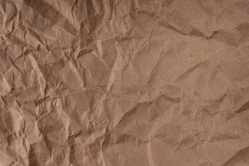 crumpled paper.sheet of brown cardboard paper. detailed high resolution texture. abstract background for wallpaper.