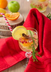 Bright refreshing summer cocktail on the background of a red napkin