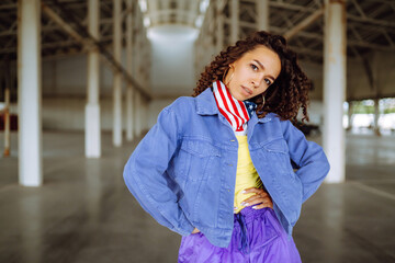 Young  woman - dancer dancing  in the underpass. Sport, dancing and urban culture concept.