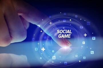 Finger touching tablet with social media icons concept