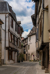 Fototapeta na wymiar narrow street in the historic fortified town center of Beaulieu-sur-Dordogne