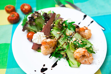 Green salad with pear (drunken pear, pear in wine) and shrimp in yogurt sauce, sprinkled with pine...