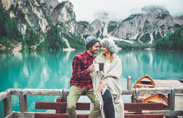 Mountain stories. Happy couple on a wanderlust vacation. Boyfriend and girlfriend spending time together at the lake