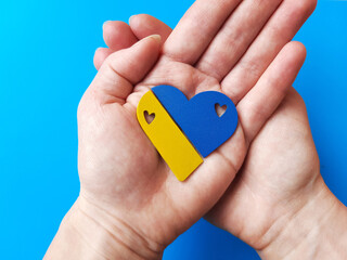 Ukrainian national flag yellow blue heart in hands