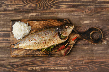 Yellow tailed mackerel with rice baked in oven