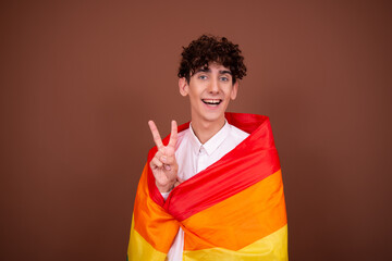 Young attractive guy with a rainbow flag.