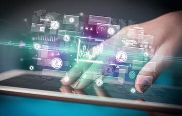 Close-up of a hand using tablet, currency concept