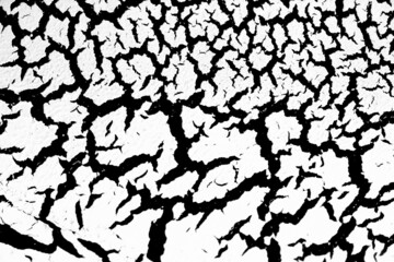 Cracked surface with white paint on a black background, craquelure effect paint. White texture of antique design in monochrome color.