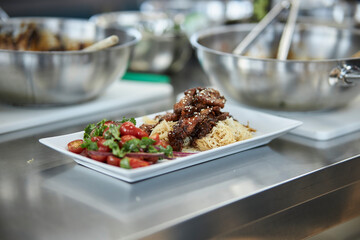 Asian noodles with beef and salad with fresh vegetables. 
