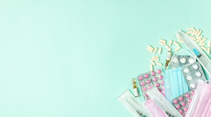 Medicines, syringes and medical masks. Simple composition. Banner.