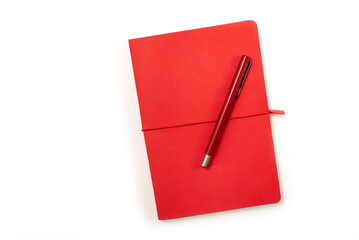 Blank red hardcover book and red pen isolated on white background with copy space. Clipping parh...