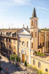 Obraz premium Top View on the street with unknown church at residential district at old town of Rome on a sunny day