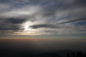 Fototapeta na wymiar Gray sky in the mountains, sunset sky