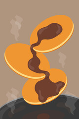 fried pancakes in a pan with chocolate sauce for breakfast