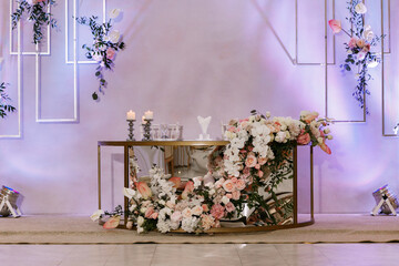 Newlyweds table with festive floral decor on wedding with natural flowers