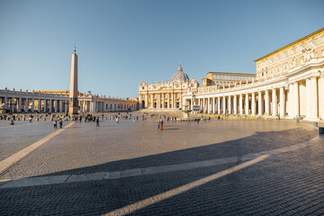Naklejka premium Saint Peter's Square with Vaticano Obelisk and church in Rome on sunny day. Concept of religious landmarks and travel Italy