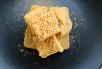 Top View of Mouthwatering Japanese Traditional Confection Called Warabimochi Covered with Kinako Flour