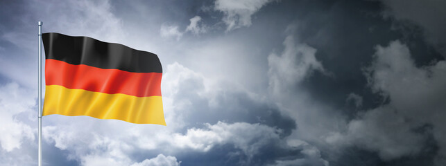 German flag on a cloudy sky
