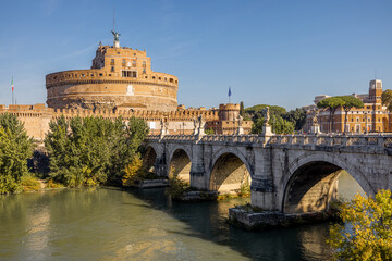 Obraz premium Landscape of Tiber river and Castle of the Holy Angel in Rome. Traveling Italy concept. Idea of visiting famous italian landmarks