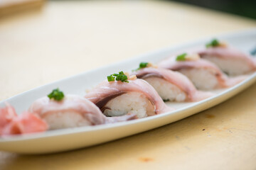 Closed up japanese sushi Maki in dish show food background