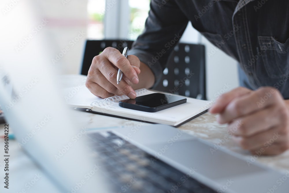 Poster close up of casual business man using mobile smart phone, surfing the internet, searching informatio