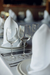 served table with glasses on a white tablecloth