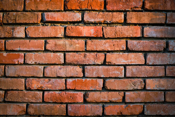 Background is wall old red burnt brick.