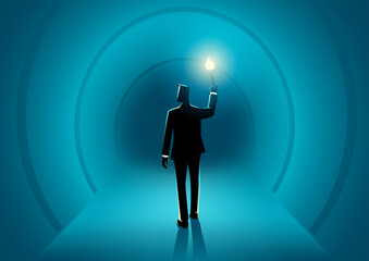 Businessman walking in the dark tunnel holding a torch