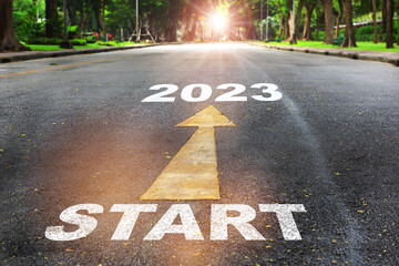 Start to 2023  written on the road on nature background with sunlight. Business planning concept and new year beginning success idea