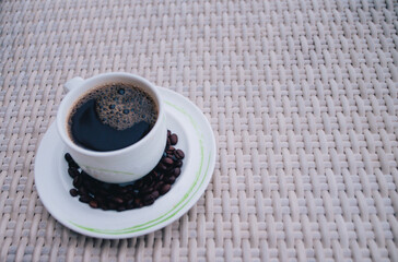 Fresh tasty espresso cup of hot coffee with coffee beans (2)
