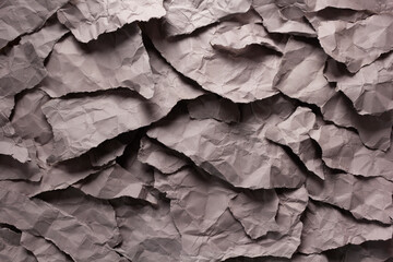 Ragged waste paper background. Recycling concept  and gray ripped paper heap