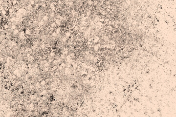 Scattered black grunge texture on a brown background