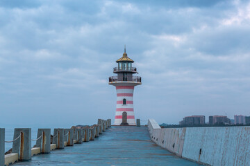 Fototapeta na wymiar lighthouse beside sea