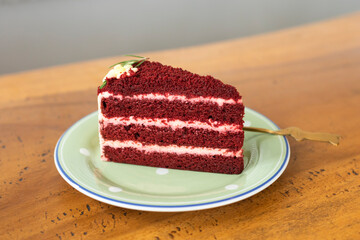classic red velvet cake on wooden table