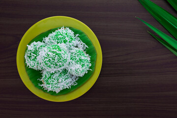 Malaysia assorted sweet dessert with coconut known as klepon or kuih onde-onde.