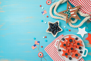 Happy Independence Day, 4th of July picnic concept with summer fruit salad on wooden background. Top view, flat lay