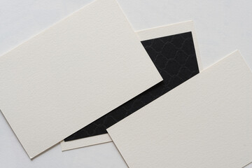 black and ivory (or white) card stock on a paper background