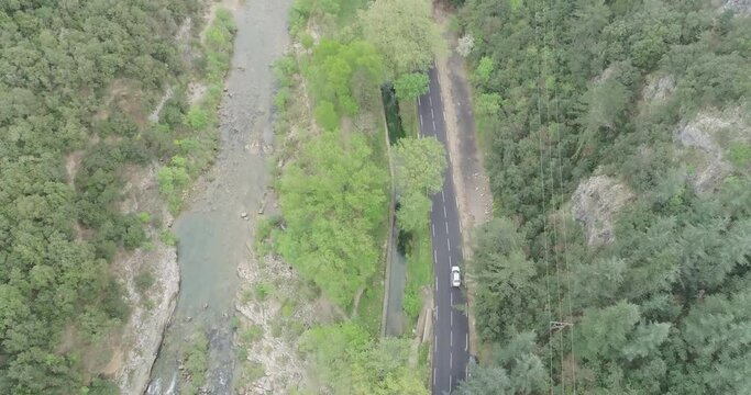 French Road, Cinematic 4k Aerial view over a asphalt road between pine tree 