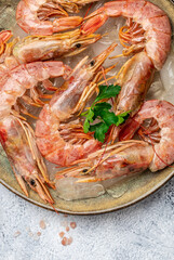 Close up Shrimps, prawns. Seafood Red Argentine shrimps with salt, Wild shrimps, ocean jumbo shrimps. vertical image. top view. place for text