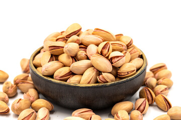 Pistachio nuts isolated on white background. Organic nuts. close up