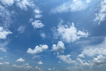 white clouds floating in blue sky on the sunny day of rainy season