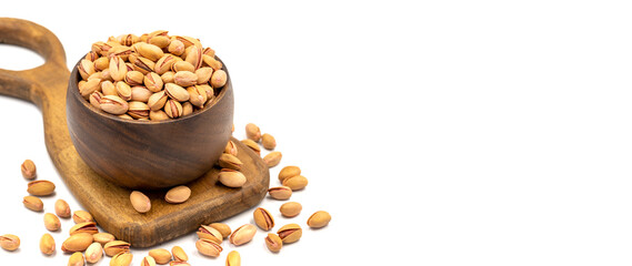 Pistachio nuts isolated on white background. Organic nuts. Copy space. Space for text. close up