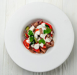 Beef tongue salad with fresh vegetables.